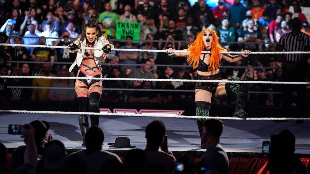 Gigi Dolin making an entrance inside the ring with Jacy Jayne