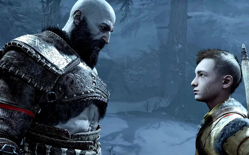 A still from God of War Ragnarok, featuring Kratos giving Atreus a serious look during a cutscene in the game