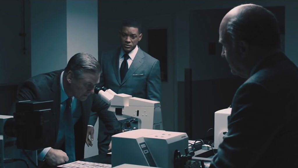  Will Smith as Bennet Omalu and Alec Baldwin as Julian Bailes in a still from Concussion