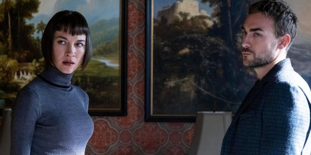 Tom Austen and Sydney Lemmon looking at someone off-camera in Helstrom