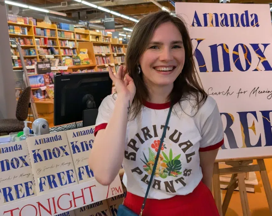 What She Does for a Living? 1 Amanda Knox smiling.