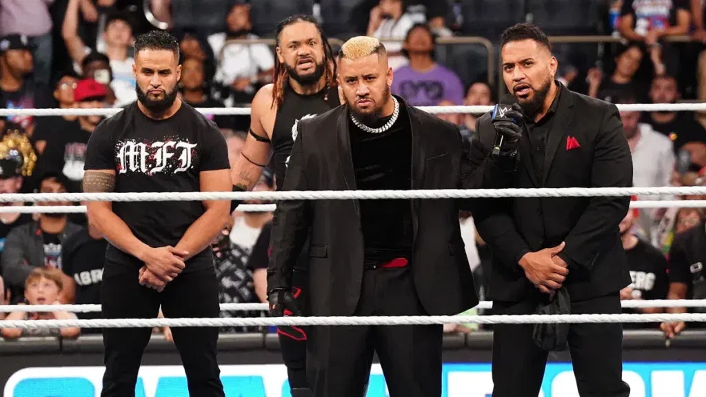 Solo Sikoa with Jacob Fatu and MFT during a WWE segment
