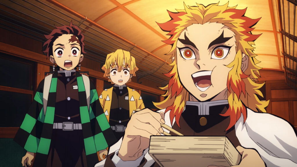 Rengoku enthusiastically eating while Tanjiro and Zenitsu watch in Demon Slayer: Mugen Train.