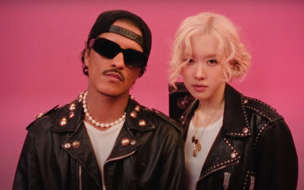 VMAs 2025: Kendrick Lamar, Sabrina Carpenter, Bruno Mars, and Other Artists With Most Nominations 6 Bruno Mars and Rose in a still from Apt. music video