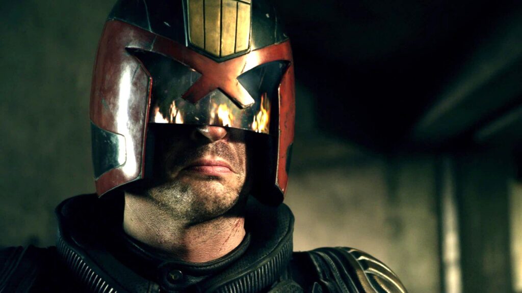 Sylvester Stallone wearing a helmet-like headgear in Dredd