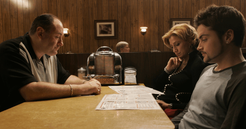 10 Best The Sopranos Episodes That Makes It Better Than Breaking Bad 3 Tony and AJ sitting at the dining table looking at the menu.