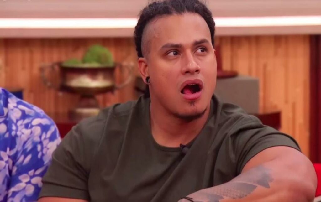 Keanu Soto listening to others talk in Big Brother.