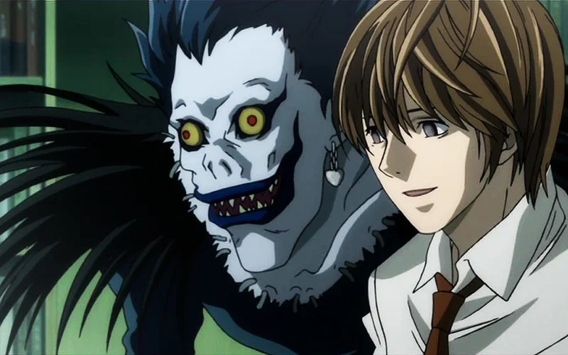 Ryuk and Light from Death Note.