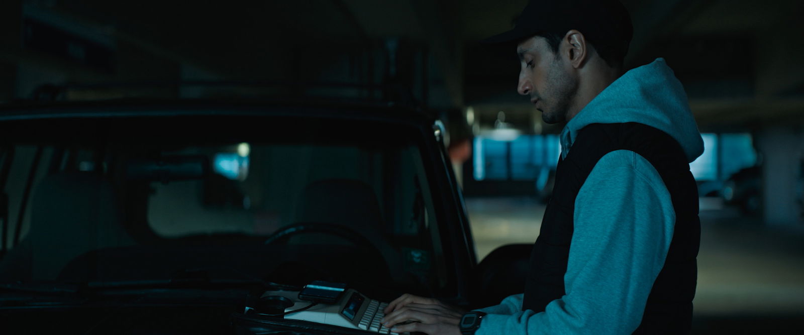Relay Review — Riz Ahmed Anchors a Thriller That Struggles to Deliver