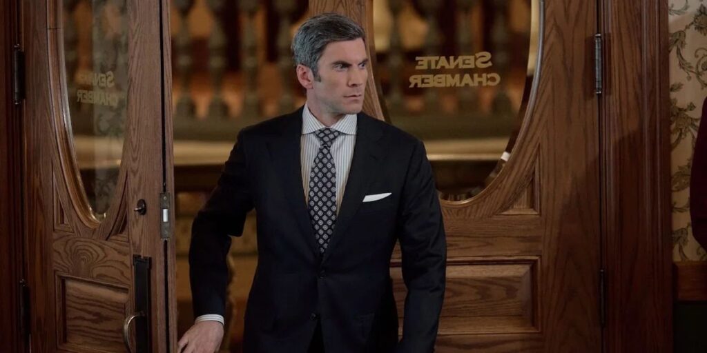 Wes Bentley as Jamie Dutton exiting a place in a suit looking stern in Yellowstone