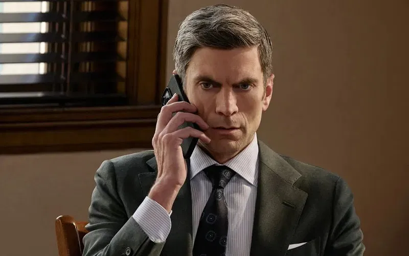 Wes Bentley as Jamie Dutton wearing a suit and holding a phone to his ear in season 5B of Yellowstone.