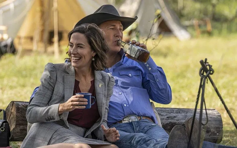John Dutton and Governor Perry having drinks and laughing