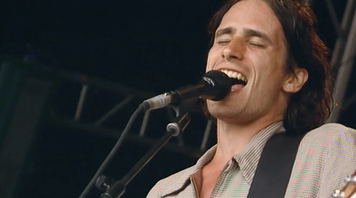Jeff Buckley singing an playing the guitar in a concert