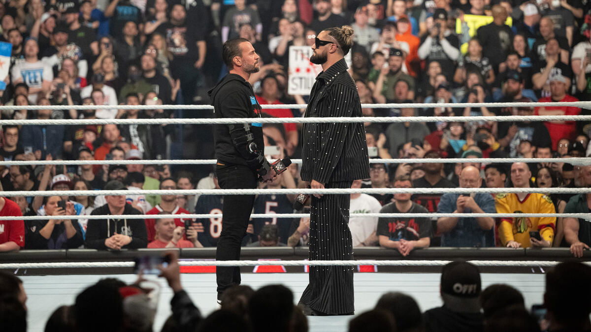 Seth Rollins and CM Punk inside the ring