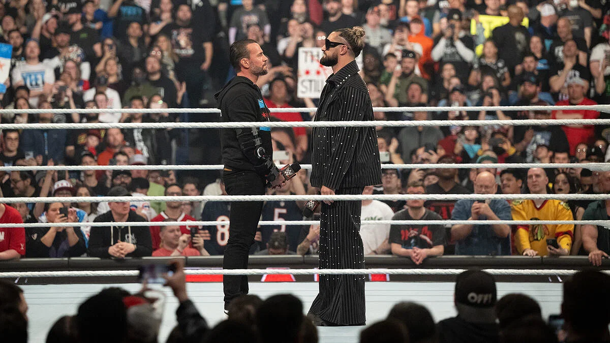 Seth Rollins and CM Punk inside the ring