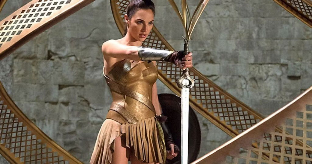 Gal gadot holding a sword as wonder woman in the 2017 movie