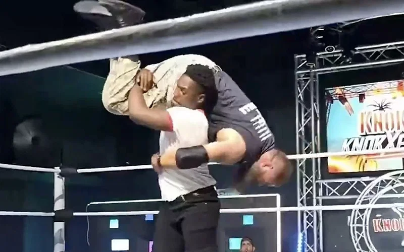 Raja Jackson throwing Syko Stu to the floor