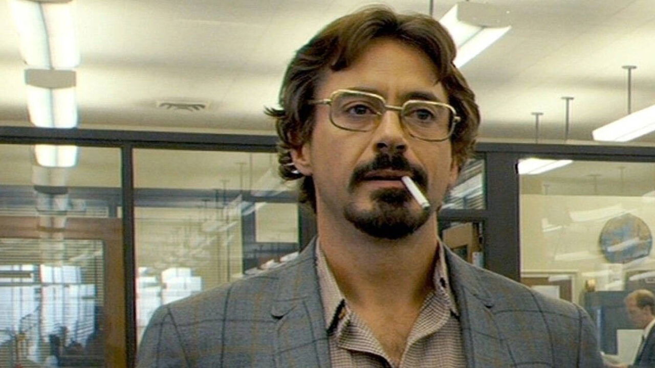 Paul Avery looks curiously in the newsroom