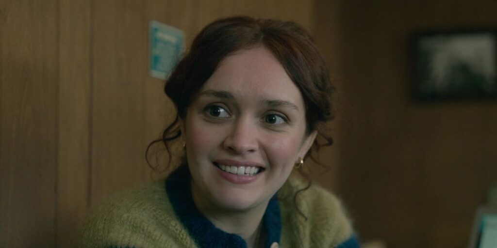 Close up of Olivia Cooke's Sid Baker smiling on Slow Horses