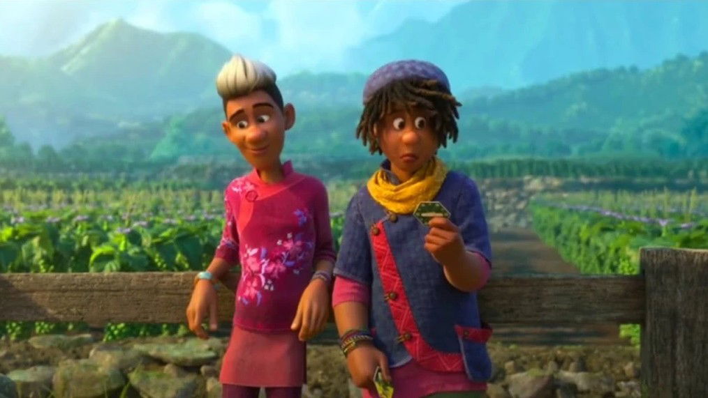 Two young people stand against a scenic backdrop of green agricultural fields and mountains - Diazo wearing a pink floral top and Ethan in a blue sweater with a yellow scarf, holding what appears to be a small object.
