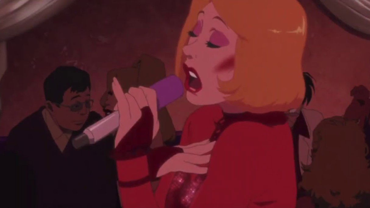 Hana with long red hair in medieval-style red clothing singing emotionally in a dimly lit interior space.