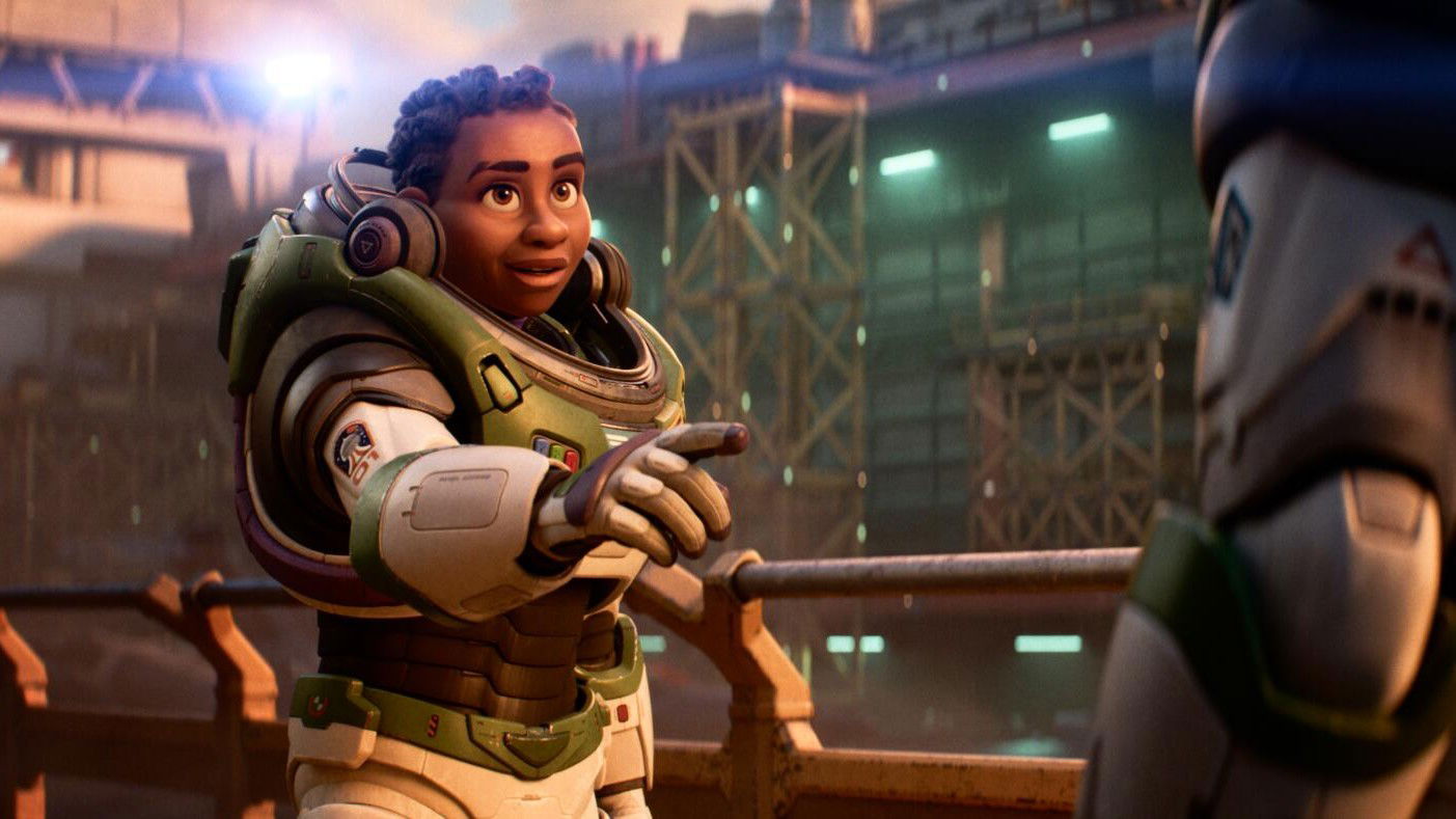 Alisha Hawthorne in the green and white suit talking while pointing at someone off-screen, standing in an urban nighttime setting.