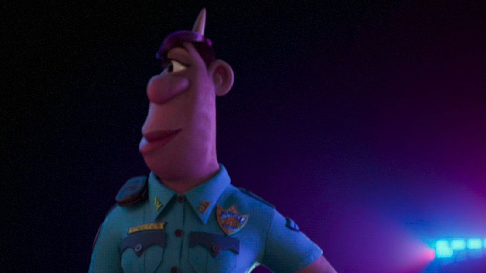 A close-up of Officer Specter in uniform, shown in dramatic purple and blue lighting.