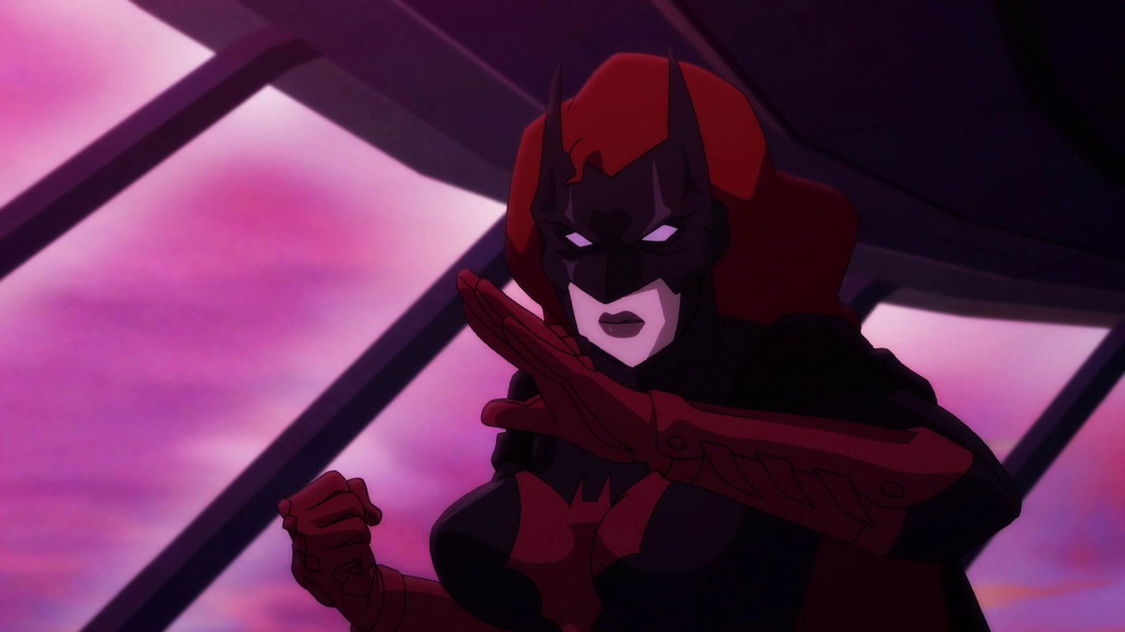 Batwoman in her distinctive red and black costume with flowing red hair, positioned against a dramatic pink and purple geometric background.