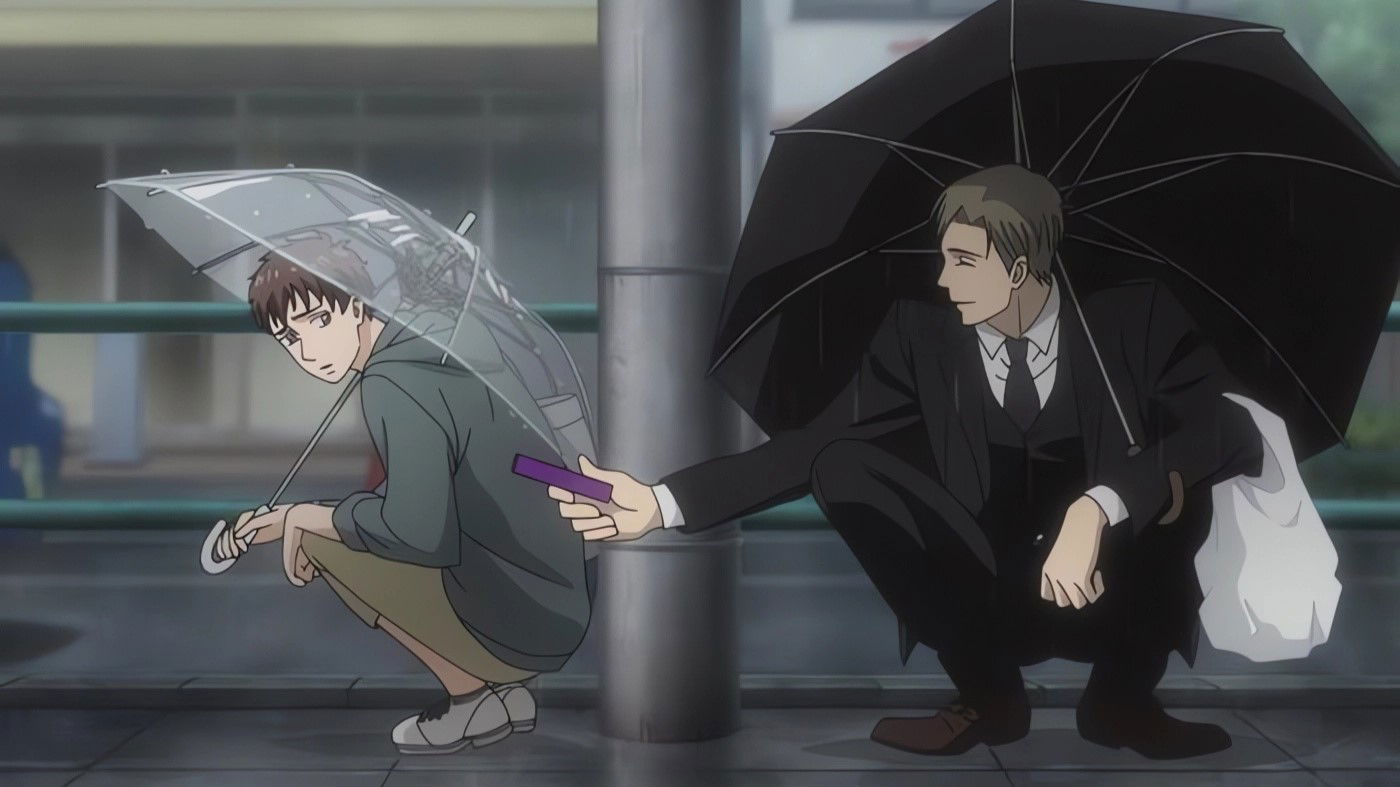 Two young men crouching under umbrellas in the rain on the sidewalk in a still from "Twittering Birds Never Fly: The Clouds Gather."