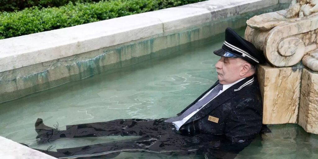 Teddy Coluca lying dead in a fountain in the 'Only Murders in the Building' season 4 finale