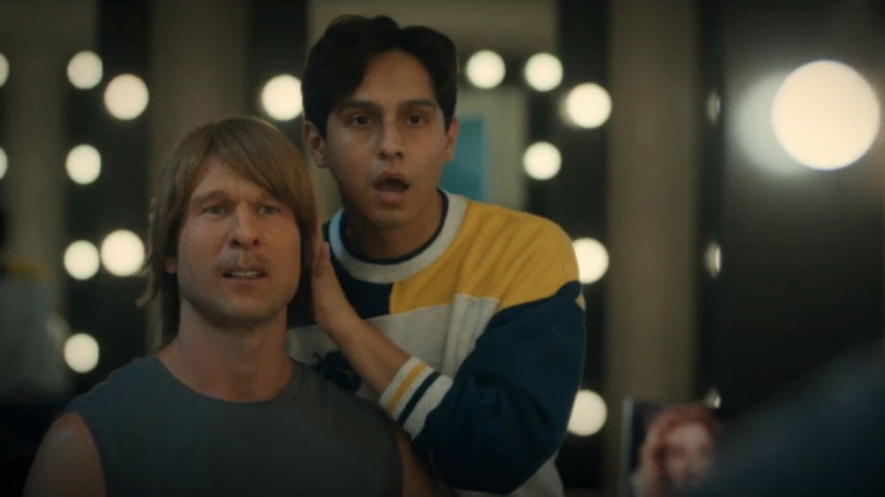 Frankie A. Rodriguez and Glen Powell looking in a mirror in Chad Powers