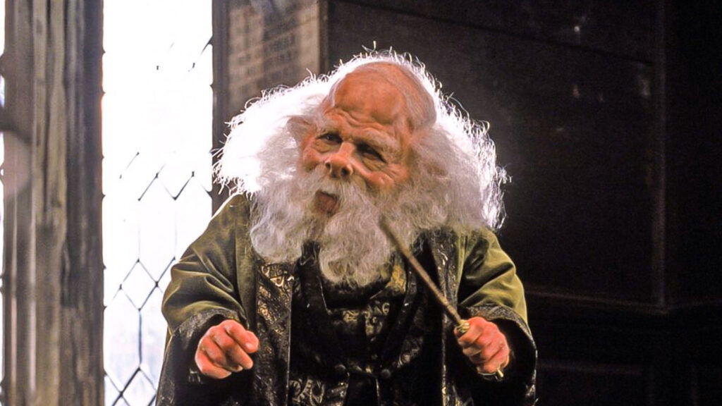 warwick davis in a still from harry potter dressed as a goblin