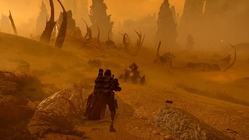 Helldivers 2: Into the Unjust gameplay screenshot shows a Terminid enemy burrowing underground.