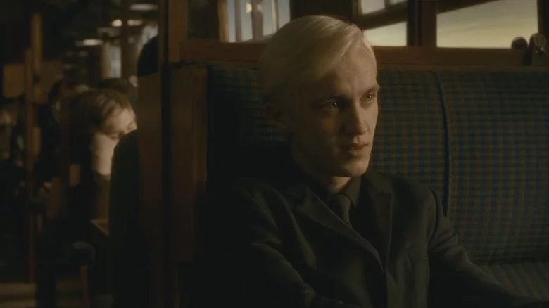 Draco on the Hogwarts express being spied by Harry