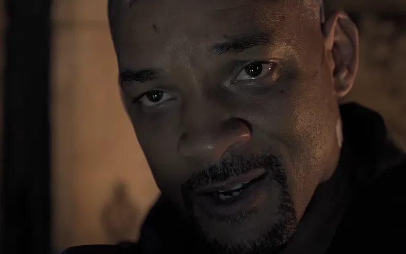 A close-up shot of Will Smith's teary-eyed face.