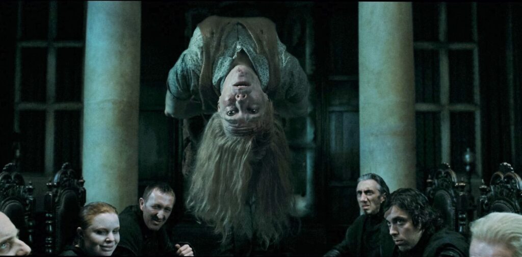 Professors Charity Burbage hung upside down in the Malfoy manor by Voldemort.