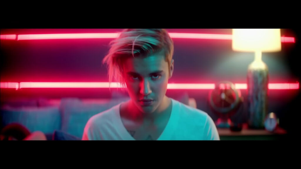 Justin Bieber is looking directly in the camera lens