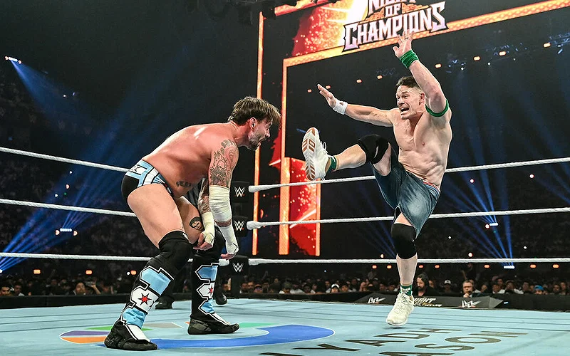 John Cena kicking CM Punk during their match at Night of Champions