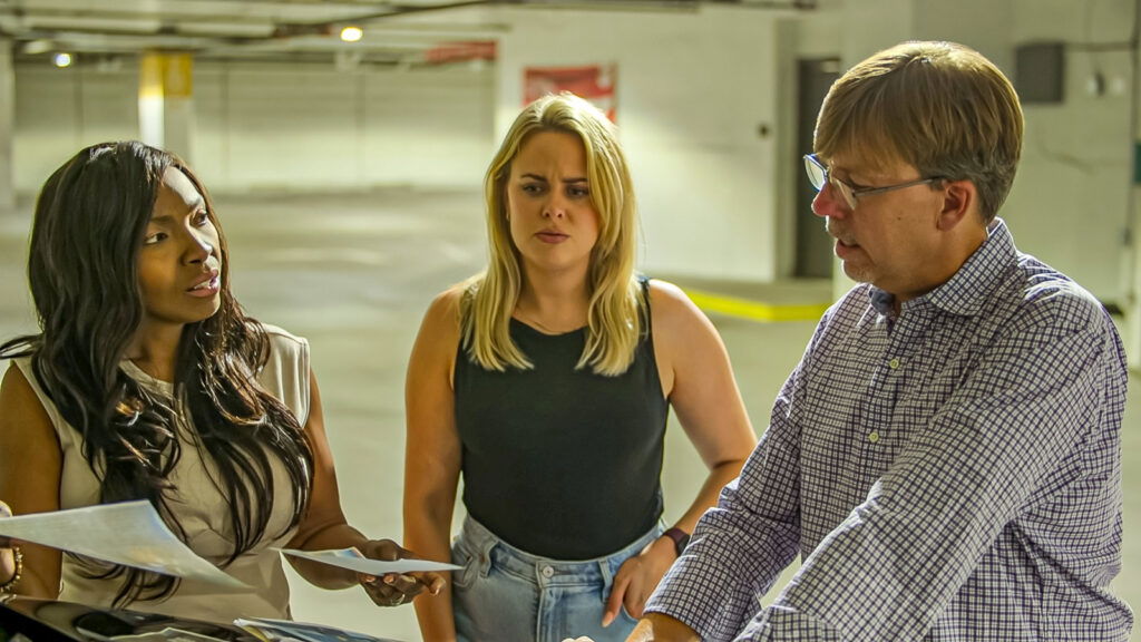 Three people discussing something together