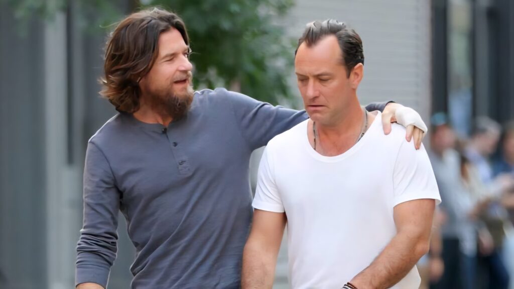 Vince and Jake walking together while talking to each other
