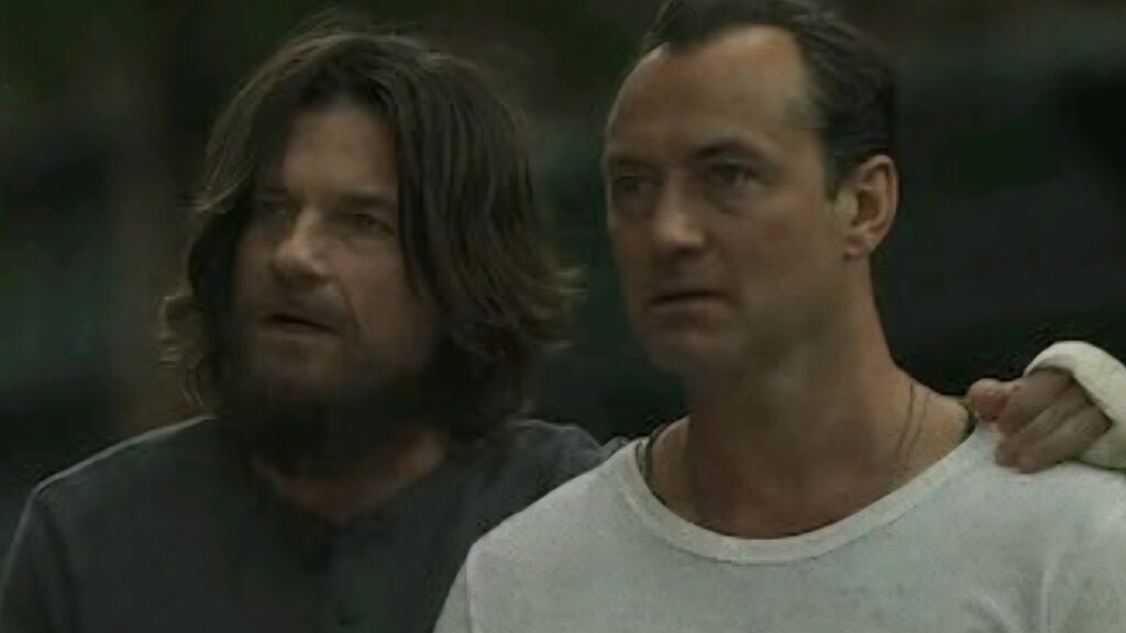 Vince and Jake looking at someone