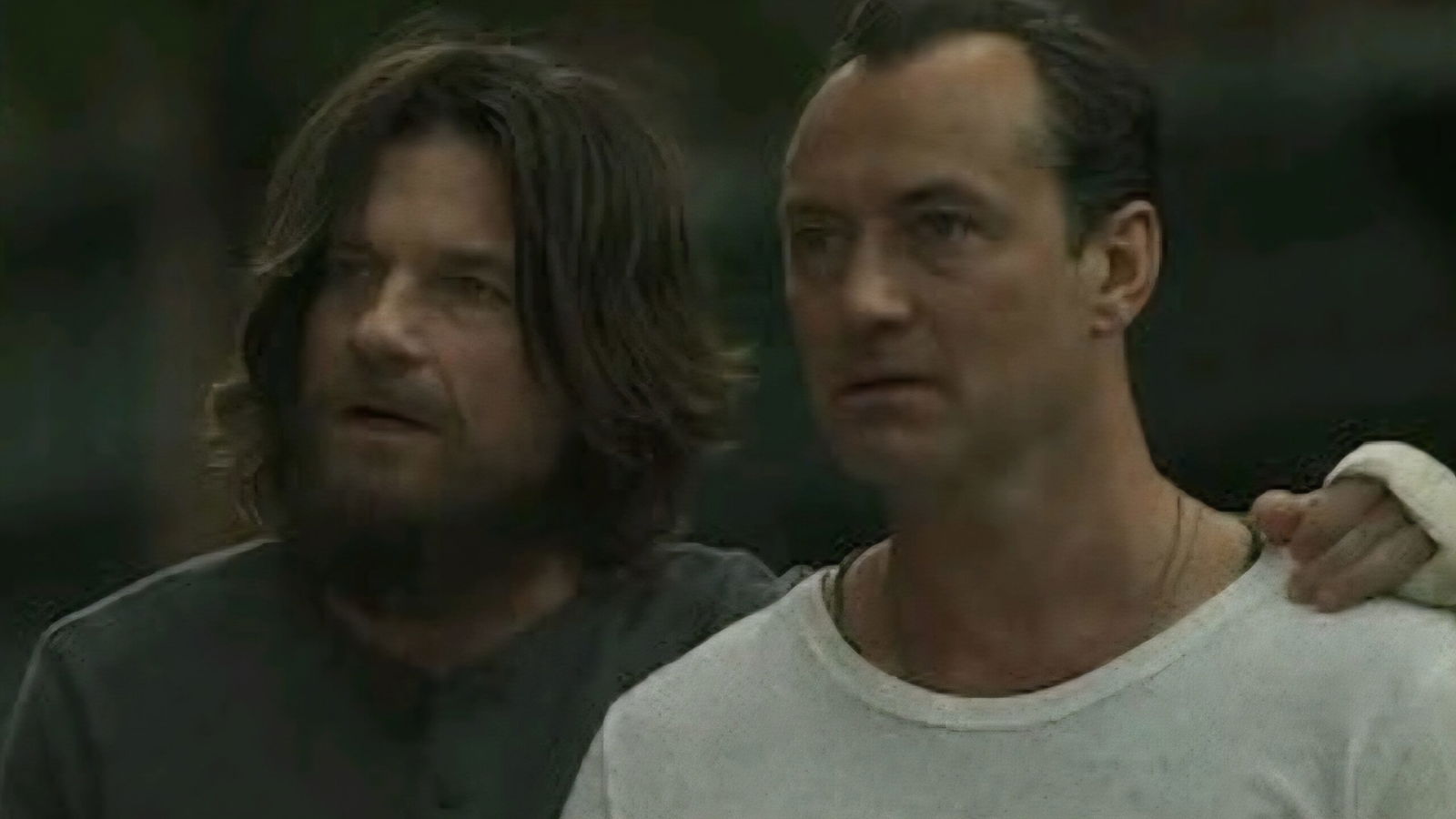 Two men look at something in the distance