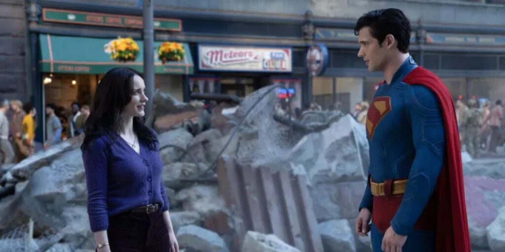 Rachel Brosnahan and David Corenswet as Lois Lane and Superman standing in front of rubble in the Superman film