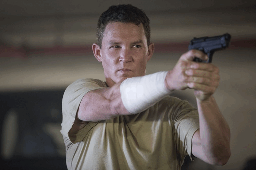 shawn hatosy holding a gun in fear the walking dead