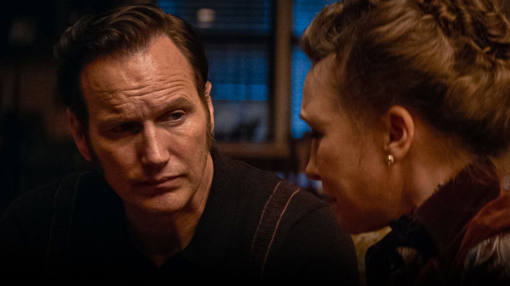 Ed looking at Lorraine while she talks in The Conjuring: Last Rites