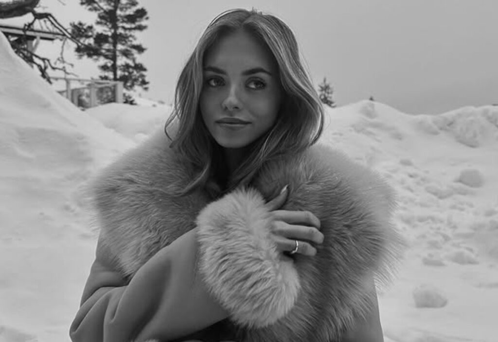 A woman posing in a winter outfit
