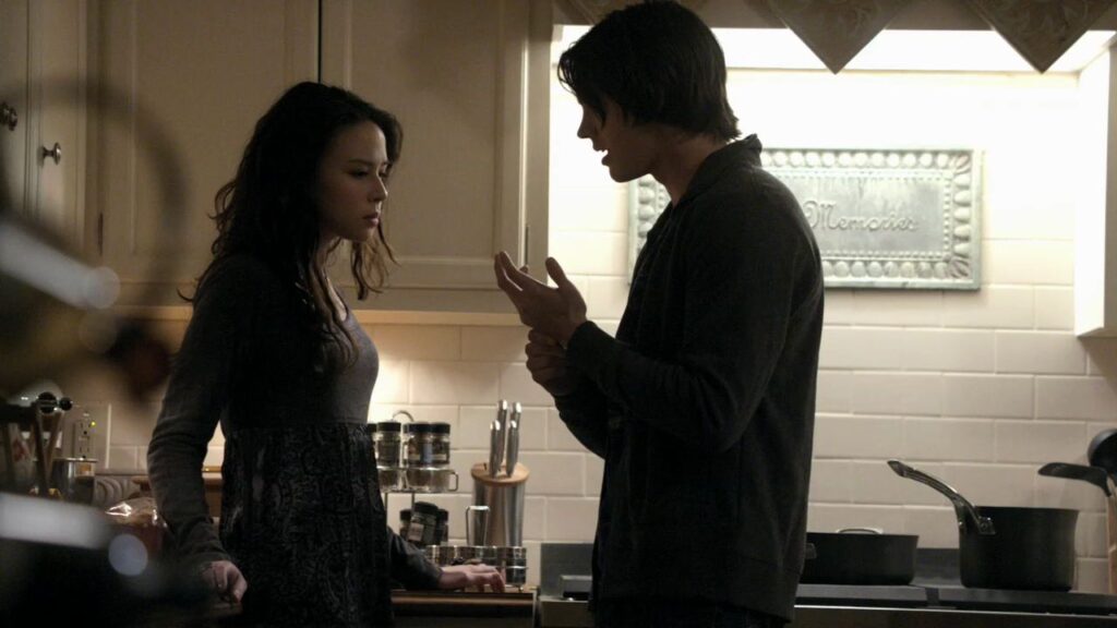 Jeremy and Anna in a kitchen setting, appearing to be having an emotional discussion during daytime.