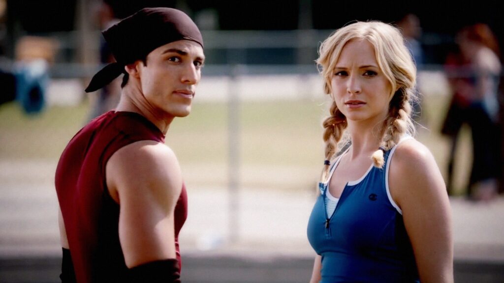 Tyler and Caroline at what appears to be a school event, with Tyler in athletic wear and Caroline in casual clothes.