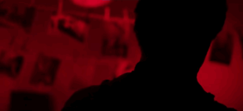 A dramatic recreation of a killer's dark room