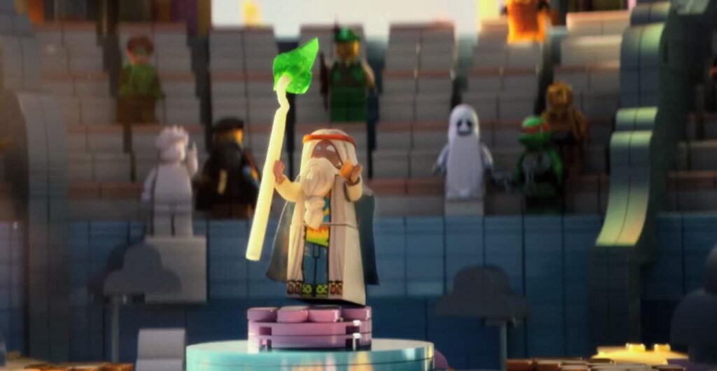Morgan Freeman's Vitruvius with a staff at the center stage of the gathering in The Lego Movie.